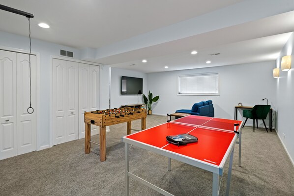 Welcome to the ultimate entertainment oasis in this lower-level living room!