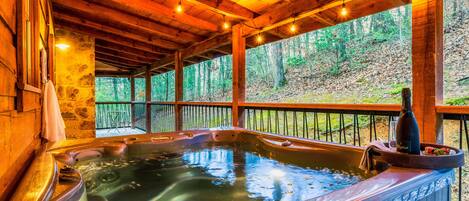 Soak your cares away in the lovely hot tub and enjoy the sounds of the forest