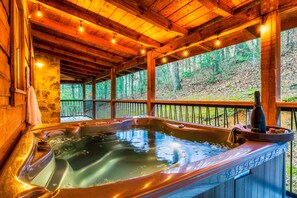 Soak your cares away in the lovely hot tub and enjoy the sounds of the forest