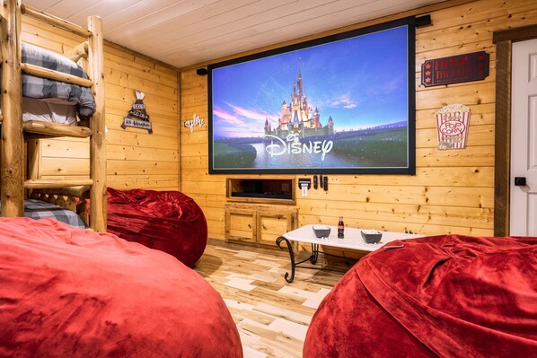 Downstairs you'll find the theater, pool table, bean bag chairs, & bunk beds!