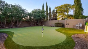 5 hole putting green w/ beautiful trees to add to the endless outdoor enjoyment