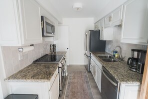 Updated full kitchen with stainless, new appliances and kitchen tools. 