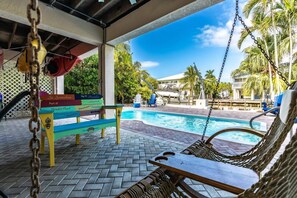 Unwind by the pool, whether you prefer to soak in the sun or lounge in the shade.