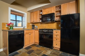 Craft a gourmet meal in the fully-equipped kitchen.