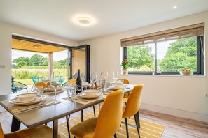 1 Long Barn, Henham: Dining area overlooking the garden and fields