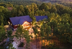 Twilight serenity at your forest retreat. Unwind with nature's symphony as dusk falls