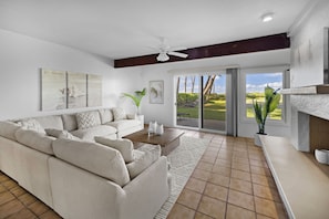 Bright and lively living room with sliding doors to your backyard paradise