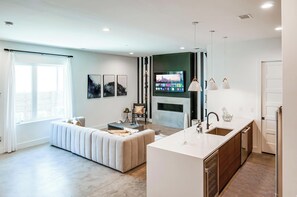 Experience your dream getaway in this chic downtown Nashville rental, ideal for large groups. Enjoy cozy evenings in the spacious living area, just minutes from the vibrant scene. Perfect for bachelorette parties or family reunions, this elegant space is your ideal home base in Music City.