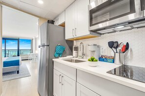 Fully-equipped kitchen with stainless steel appliances, perfect for cooking up a storm. 

