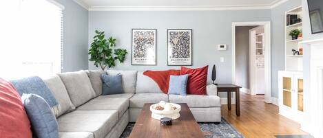 Living room with big, comfy pullout mattress (queen) couch and smart television.