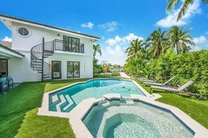 Escape to paradise with a dip in our heated pool and Jacuzzi