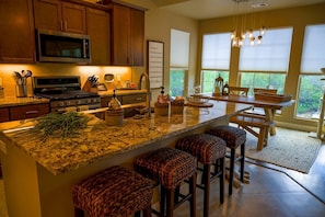 Open kitchen and dining room with bar seating