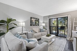 Living Area with Balcony overlooking pool, lagoon