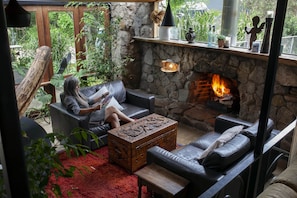 Sunken conservatory with open fire