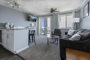 The cozy living room with a 50" TV.