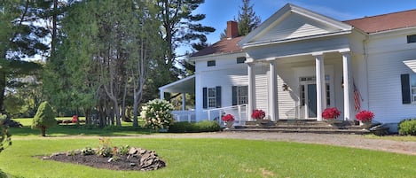 Front exterior of The 1819 House - Classic tall columns line the front stone porch.