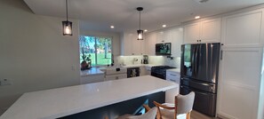 The kitchen has abundant storage with soft close doors and drawers