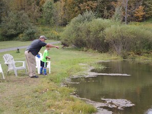 They're feeding the fish in the private pond!