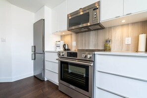 Stainless steel appliances in the kitchen.