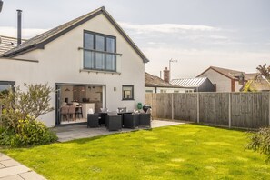 Wynholme, Holme-next-the-Sea: Enclosed rear garden with outdoor dining furniture