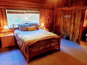 Master bedroom with Queen bed, barn wood throughout with en suite bathroom.