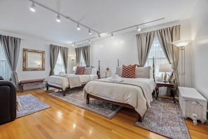 Large bedroom with 2 queen beds and daybed with a pull-out trundle underneath