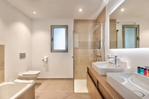 Bathroom with bathtub and shower