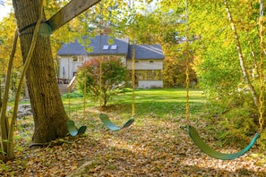 A large yard and swingset are perfect for families with kids!