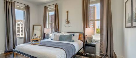 Master bedroom with King bed, fold out full bed, and smart TV.