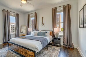 Master bedroom with King bed, fold out full bed, and smart TV.