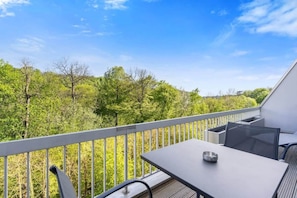 Inviting balcony with outdoor seating to enjoy the serene parkland views. Direct bookings: www.arcaproperties.lu