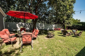 Huge fenced backyard area with grill