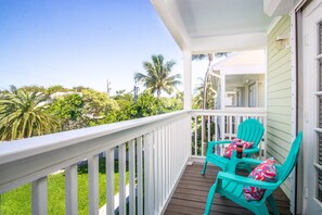 Enjoy the tropical view from the upstairs porch