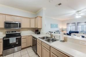 Fully equipped kitchen with stainless steel appliances and plenty of counter space