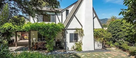 Backyard terrace with wisteria covered outdoor dining, gas BBQ, gas fire pit