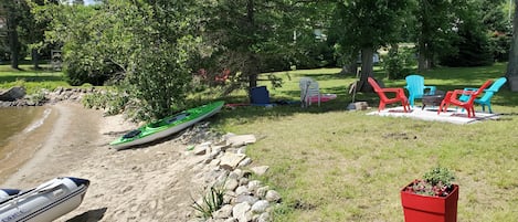 Beach and Kayak and Motor boat on site for rental .