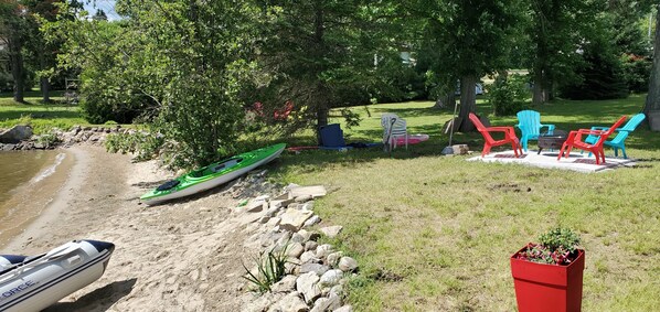 Beach and Kayak and Motor boat on site for rental .