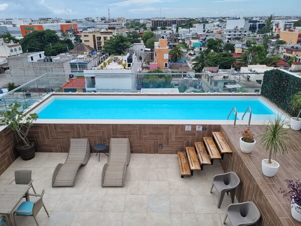 Rooftop pool with views of the city