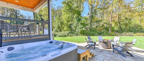 6 person hot tub, brand new, with stone patio in background