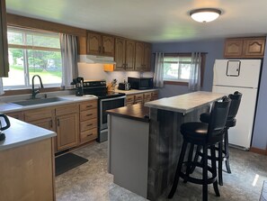 Spacious kitchen with convenient island/bar seating