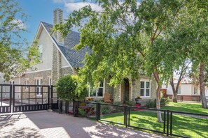 Gated driveway and gated front yard.  Remotes provided for parking