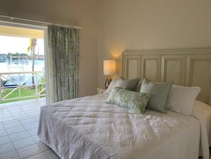 Master Bedroom with King size bed.  A/C and Ceiling fan.  Leads out onto a balcony with gorgeous Marina views.