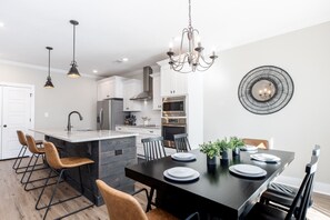 Open concept dining room/kitchen with fully stocked kitchen