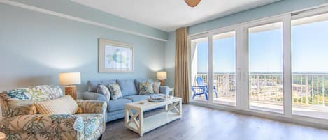 Living room with access to the private balcony.