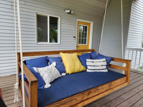 Watch the sunrise or take an afternoon nap on this oversized porch swing.