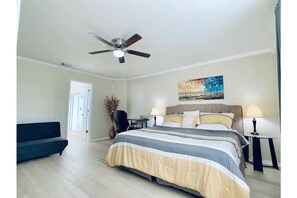 room #1  Master bedroom with king-sized bed+futon and smart TV upstairs.