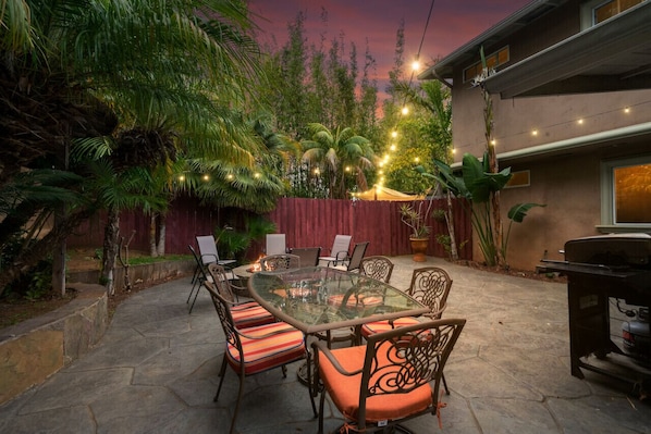 Welcome to your tropical oasis with patio table, BBQ grill and bonfire pit