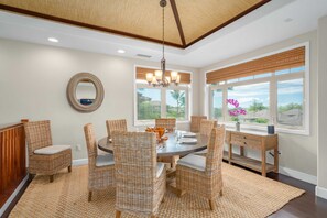Dining room seats up to 8 people.  From here you have views of the ocean, sunsets, Maui, and Kohala Mountain.