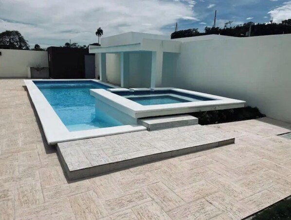 Private pool with kiddie pool.