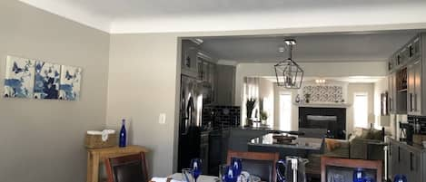 In dining room looking through to kitchen and family room